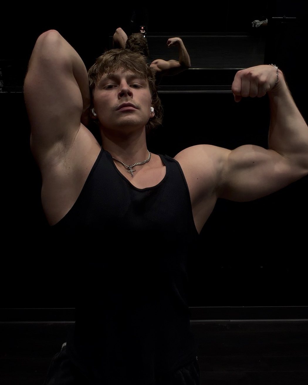 Stepan flexing in the gym