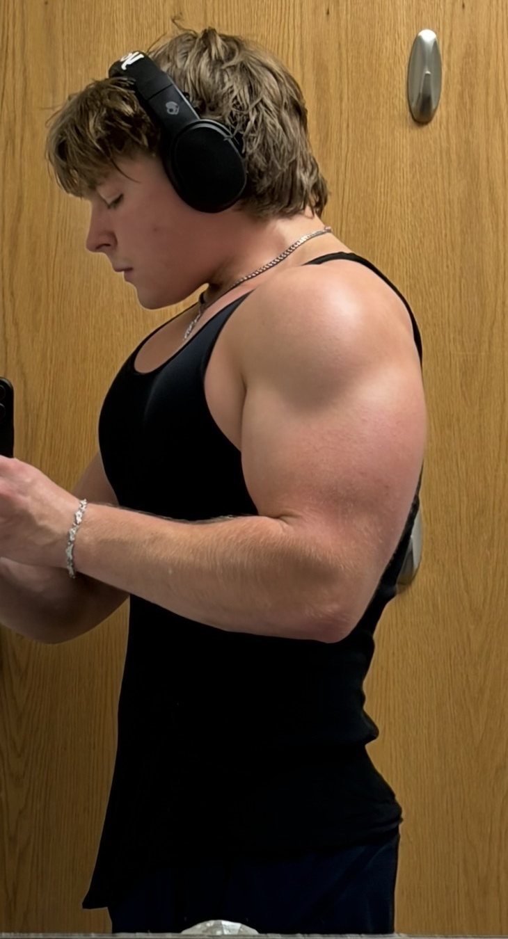 Stepan side profile in a black tank top